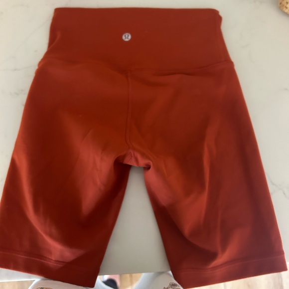 Like new Lulu lemon short. Size 2. Rust/orange color. - Picture 2 of 3
